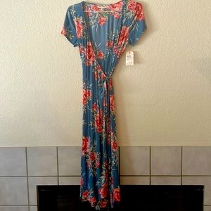 Beautiful Billabong wrap around dress. Never worn, tags still on.